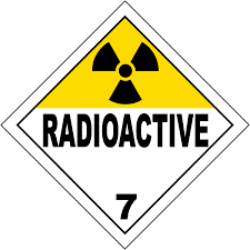 The vehicle placard is a square turned on its side, at least 250 mm long on each side, with a white 5 mm border. The square is split into two triangles on the top and bottom. The top triangle is yellow, and contains the radioactivity symbol. The circle in the middle of the symbol is at least 10 mm in radius. The bottom triangle is white, and contains the word 'RADIOACTIVE' at the top and the number '7' at the bottom.