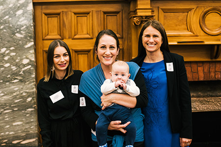 Three Breastfeeding Works volunteers (and one baby) at the awards ceremony. 
