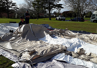Volunteers setting up the tents for the facility. 