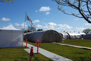 Fixed facility set up with multi-room tents. 