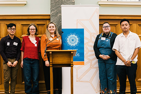 Photo of five Peer Tree volunteers at the award ceremony. 