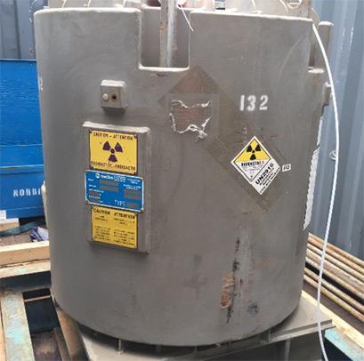 The shielding package has two radioactive warning labels on it.