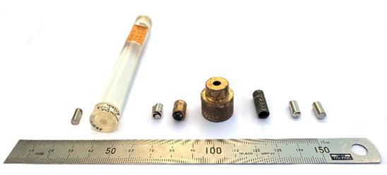 A selection of small sources lined up against a 15cm ruler for scale.