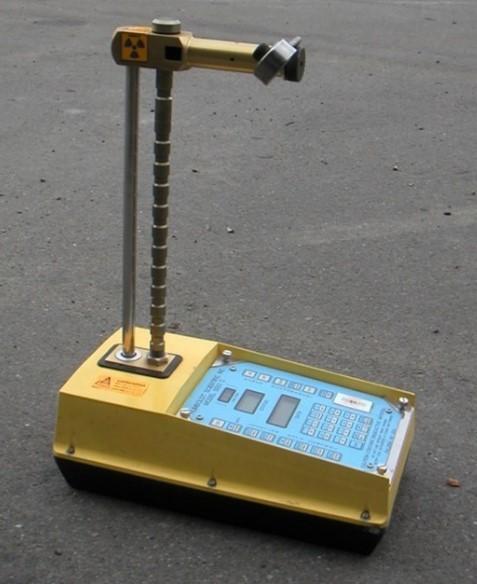 A portable-looking moisture density gauge.