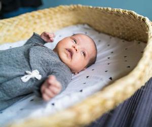 A baby in a bassinet. 