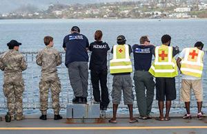 NZMAT and other volunteers looking across the water to the coast.