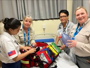 Four NZMAT volunteers checking out a supply kit.
