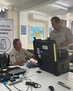 Two volunteers working in a COVID-19 vaccination centre.