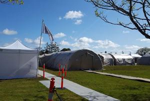 Fixed facility set up with multi-room tents.