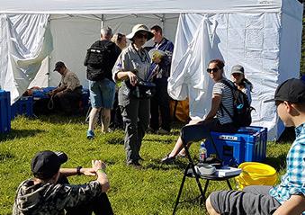 Volunteers and members of the public at the gazebo facility.